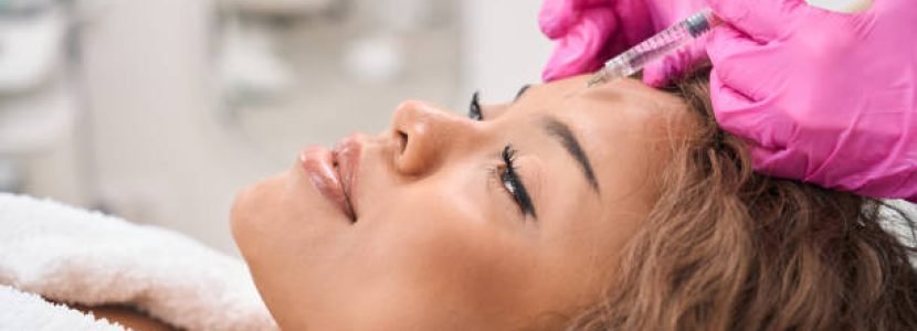 Modern woman receives botulinum toxin injections in a cosmetology clinic, patient is provided with maximum comfort and attention